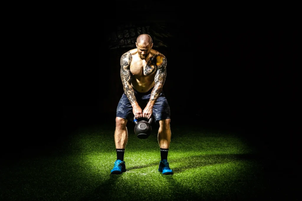 man working out with a kettlebell